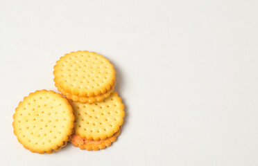 Cheese-flavored biscuits, photo from the top corner, isolated on a white background
