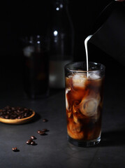 Cold coffee with ice in low key