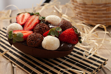 
homemade easter egg with chocolate, strawberry, brigadeiro and nest milk
