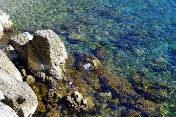 Sea environment with rock and beautiful sea beach and turquoise seawater