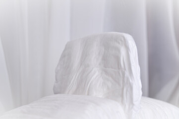 Fototapeta na wymiar white pillow on bed