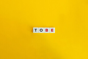 To Be Verb on Letter Tiles on Yellow Background. Minimal Aesthetics.