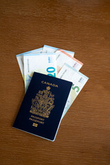 Canadian passport on background with Euro  currency.