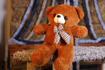 Brown teddy bear with cool bow tie