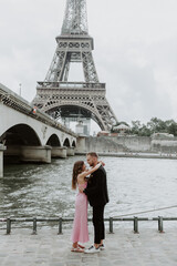 Handsome man doing a marriage proposal on bright sunny day in Paris, France