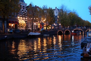 Fototapeta premium A dusk scenery of Amsterdam with a canal and canal houses