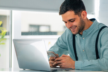 businessman with mobile phone or smartphone and computer