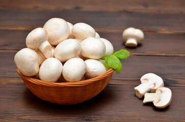 fresh champignons in a basket close-up