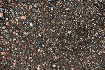 Pattern and texture of a driveway with gravel in cement and tarmac