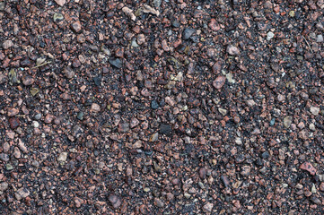 Pattern and texture of a driveway with gravel in cement and tarmac