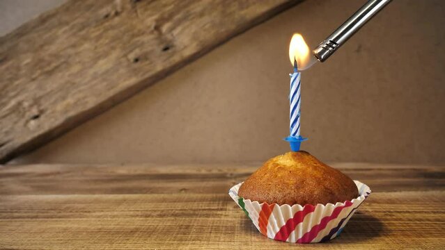 Cupcake and candle - happy birthday idea.concept for congratulations on holidays.Copy space.place for text.