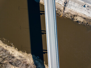 Aerial view of new bridge over Venta river in sunny spring day, Kuldiga, Latvia.