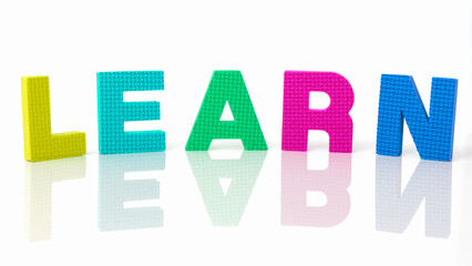 Close-up on the word learn written in different colors. Concept of learning, study and assimilation. Try to learn concept. Learning by making mistakes. Learning while having fun.