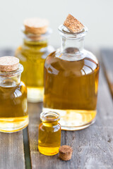 Assortment of organic essential oils. Natural moisturizing body and face treatment. Plant extract for healthy young skin. Relaxation, aromatherapy, salon spa. Close up, macro view