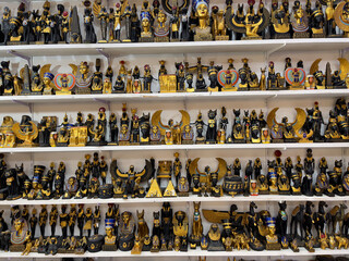 Figurines of Pharaohs, pyramids and sphinxes in souvenir shop in Hurghada, as travel concept. Souvenirs from Egypt