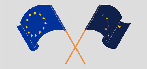 Crossed and waving flags of the European Union and the State of Alaska