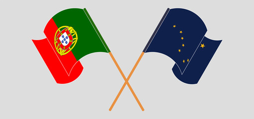 Crossed and waving flags of Portugal and the State of Alaska