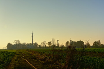 Farmland with radio tower of an airport in the flemish countryside