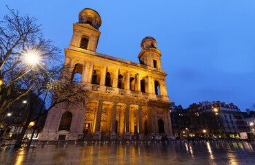 The famous church of Saint Sulpice at rainy night , Paris, France.