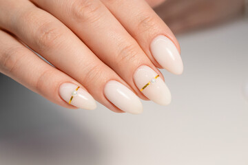 Nude manicure. Gel polish on milky nails. Almond shaped nails. Gold design nails. Beautiful...