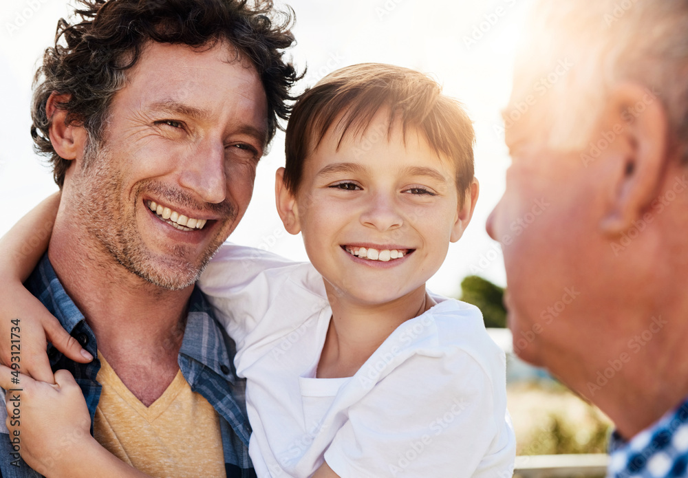 Poster Great role models from boyhood to manhood. Shot of a young boy spending time with his father and grandfather outdoors.