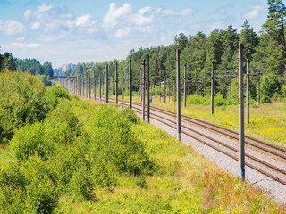Fototapeta na wymiar Above view to the two ways railway during the summer time. Daytime.