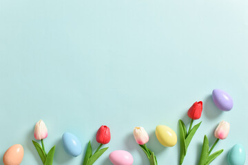 Easter banner with tulips and eggs. Space for copying. Flat position, top view.