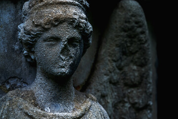 Very ancient destroyed statue of angel as symbol of death and eternal life of human soul.