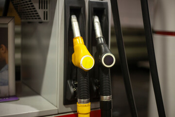 Road gas station. Hoses for refueling the machine. Petrol pump. Oil prices affected gas prices.