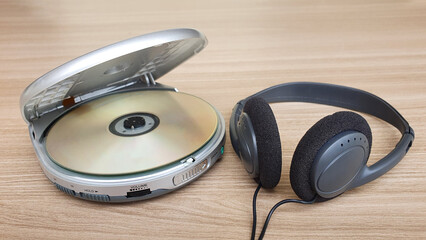 Open cd player with disk on white background.