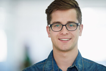 Fototapeta na wymiar Hes got a strong work ethic. Portrait of a handsome young office worker.