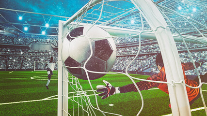 Goalkeeper in orange uniform catches the ball in the stadium during a football game