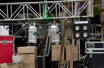 set up of recital stage with lights, speakers and boxes