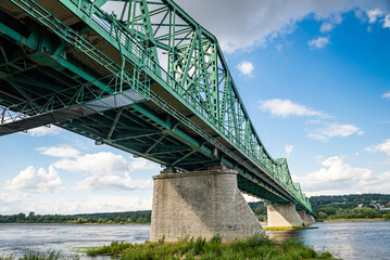 Wloclawek, Poland - August 11, 2021. Green bridge Marszalka Rydza-Smiglego over Vistula river in Summer