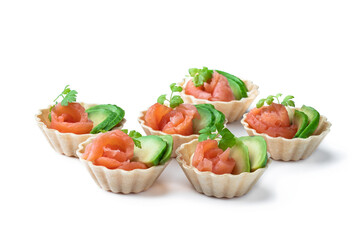 Tartlets with cream cheese and smoked salmon isolated on white