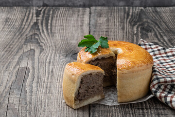 Homemade Meat pie on wooden table