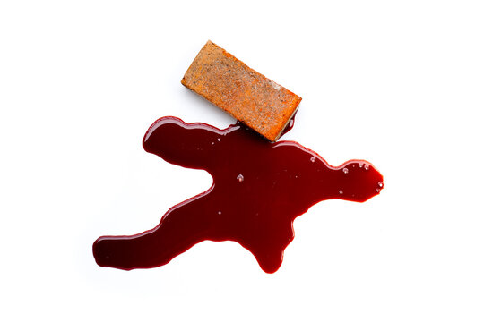 Brick with blood on white background.