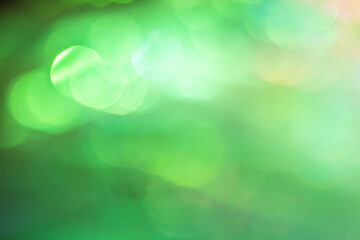 背景素材　キラキラ　グリーン系の玉ボケ