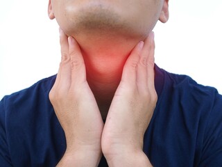 Naklejka premium Asian men have a sore throat caused by laryngitis. closeup photo, blurred.