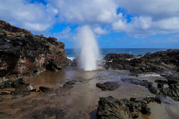 Marine geyser of Nakelele Blowhole on West Maui in the Hawaiian Islands, USA - Spout of water on...