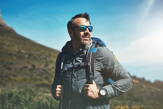 Always Be Proud Of How Far Youve Come. Shot Of A Middle Aged Man Hiking In The Mountains.