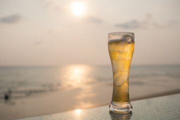 glass of beer with sea background, celebration