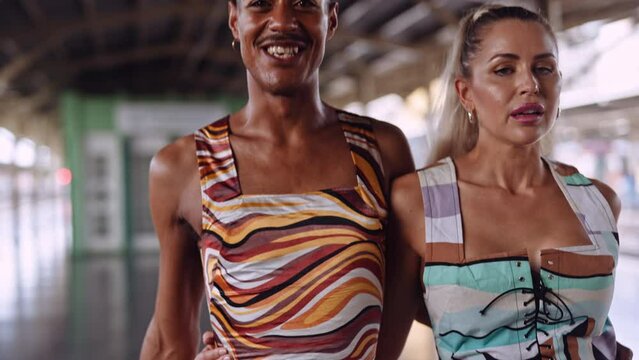 Fashion Models Walking To Camera In Train Station