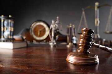 Law and justice concept. War crimes. Gavel, Themis sculpture, law code and scale in lawyers office....