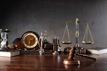 Law and justice concept. War crimes. Gavel, Themis sculpture, law code and scale in lawyers office....