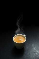 cup of coffee on black table in cafe