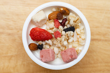 top view yogurt with nuts and dry fruits and melon seeds