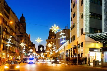 Tuinposter Christmas decorations on the streets in Barcelona in the evening, Catalonia, Spain © JackF