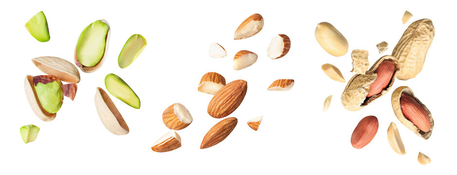 set raw cracked pistachios, almonds and peanut isolated on white background. Concept of Pistachios almonds and peanut is torn to pieces close-up. clipping path
