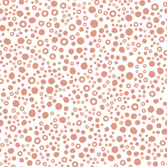 Abstract spotted seamless pattern in pastel colors. Brown dotted background. Vector hand-drawn illustration. Perfect for print, decorations, wrapping paper, covers, invitations, cards.